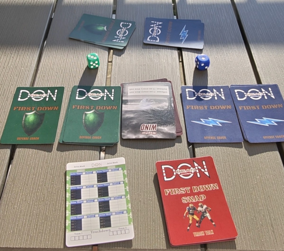 FIRST DOWN SNAP card game with cards, dice and drive block